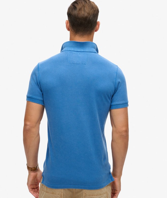 Man wearing a blue polo shirt on a white background