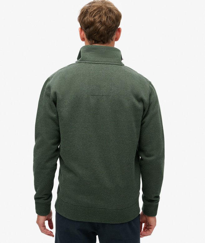 Person wearing a green zip sweat  on a white background