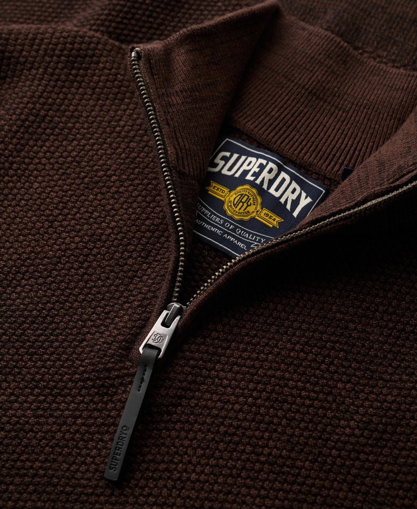 Close-up of a sweatshirt jacket with a Superdry label.