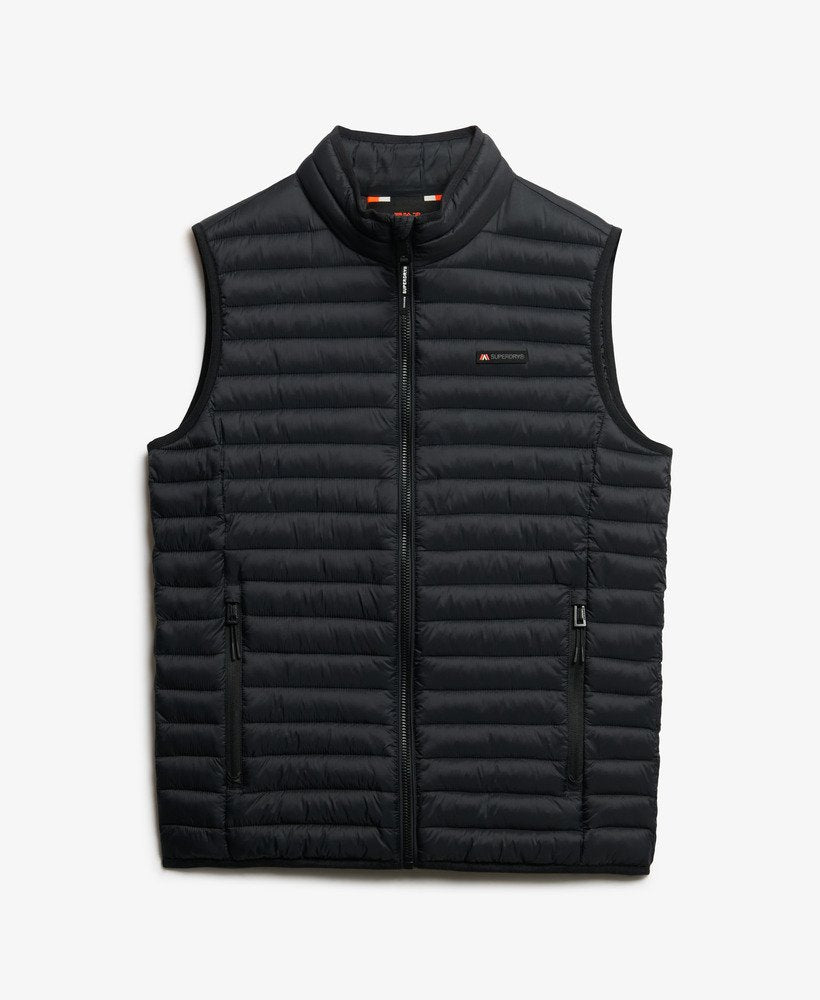 Black puffer vest on a light gray background