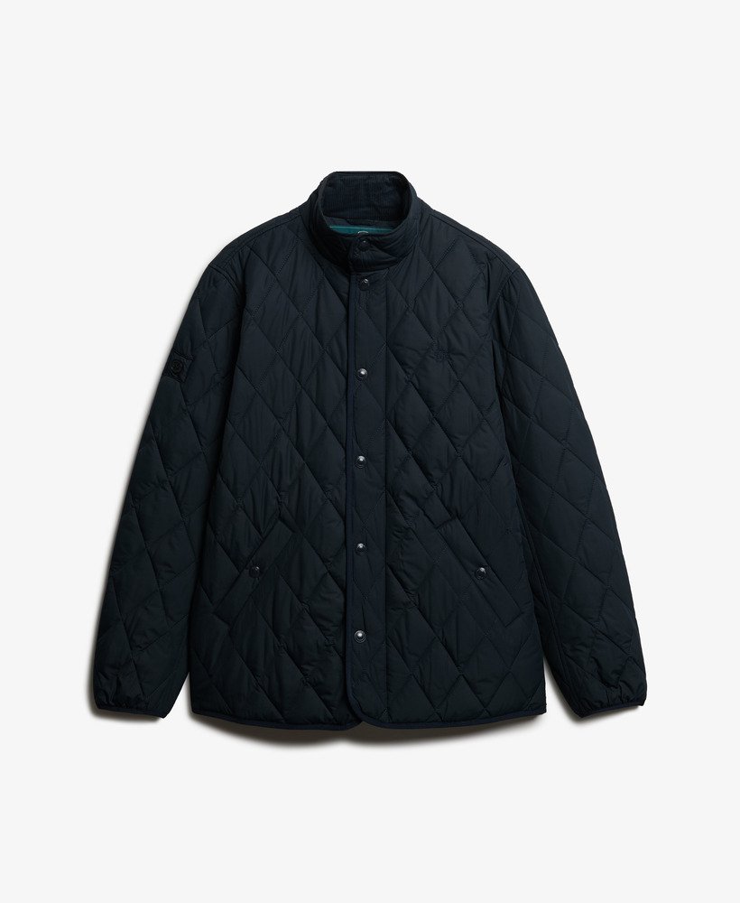 Navy quilted jacket on a light gray background