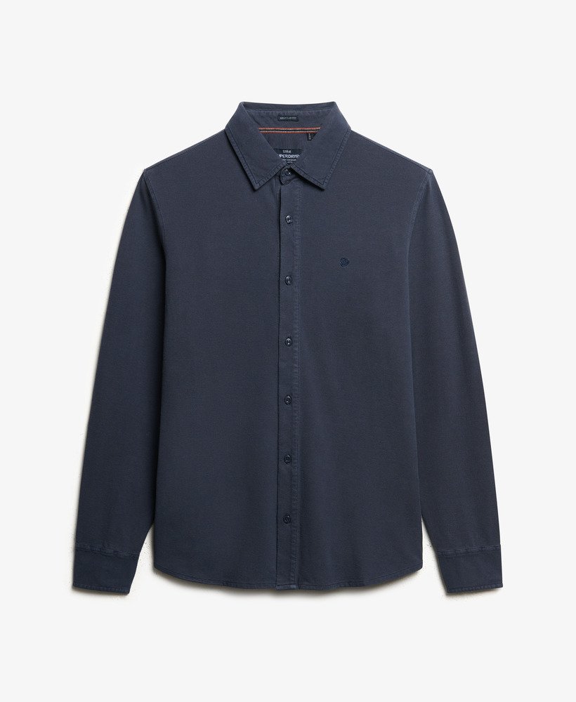 Navy blue shirt on a light gray background