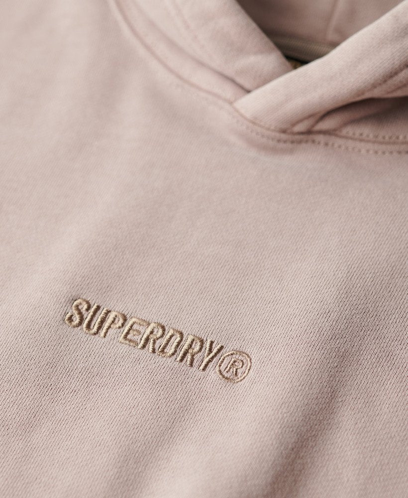 Close-up of a beige hoodie with Superdry logo