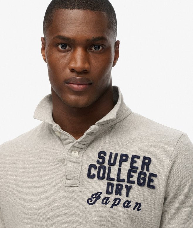 Man wearing a gray sweater with 'Super College Dry Japan' text on a white background