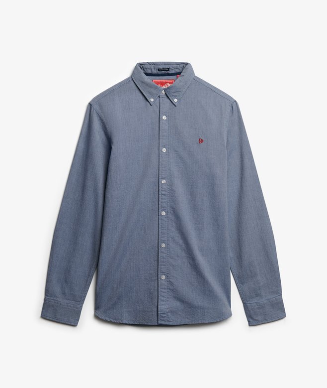 Blue button-up shirt with a small red logo on a white background