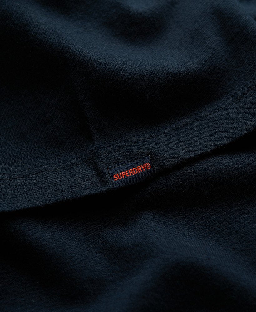Close-up of a navy blue fabric with Superdry logo tag.