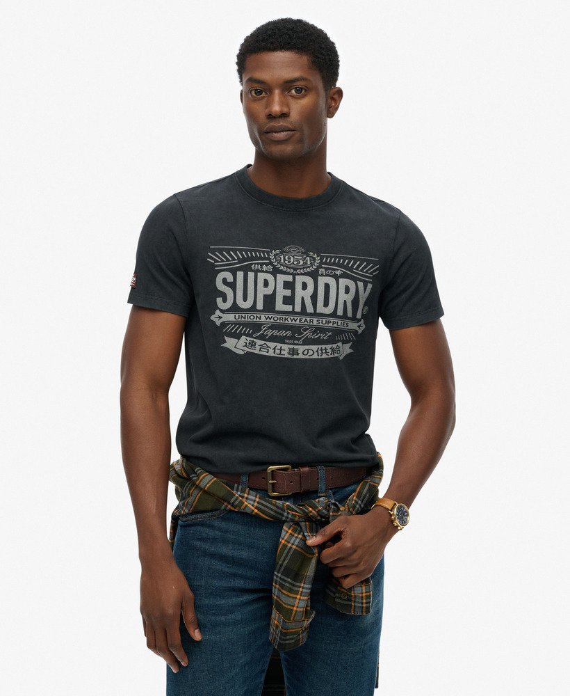 Man wearing a Superdry t-shirt on a white background