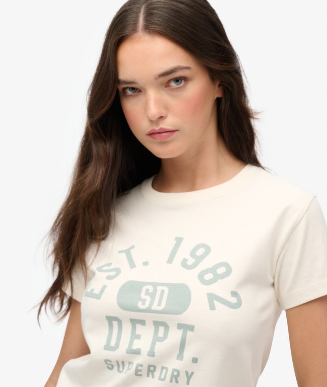 Woman wearing a white t-shirt with text and logo