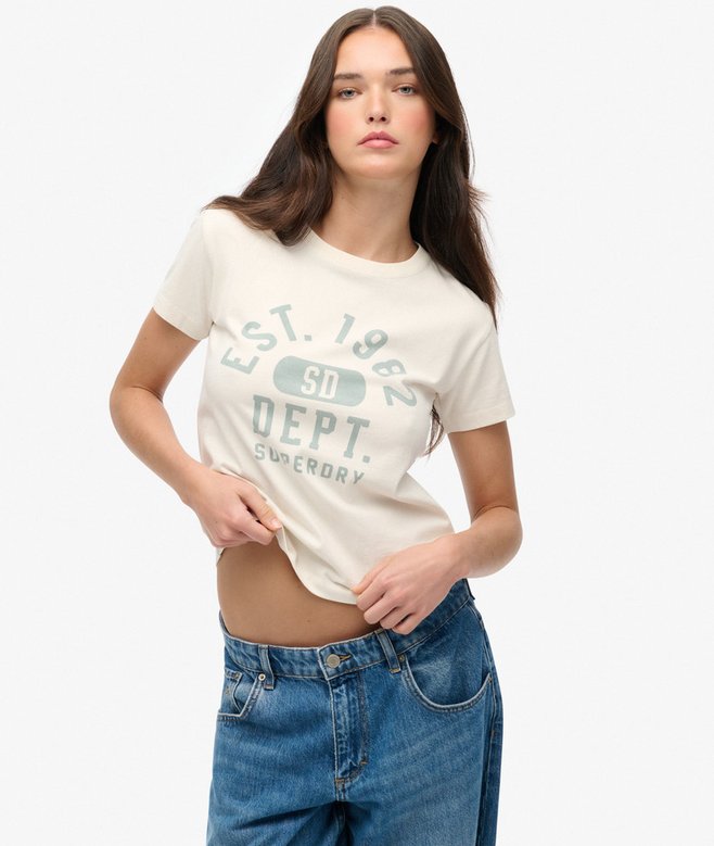 Woman wearing a white t-shirt with text and blue jeans on a white background