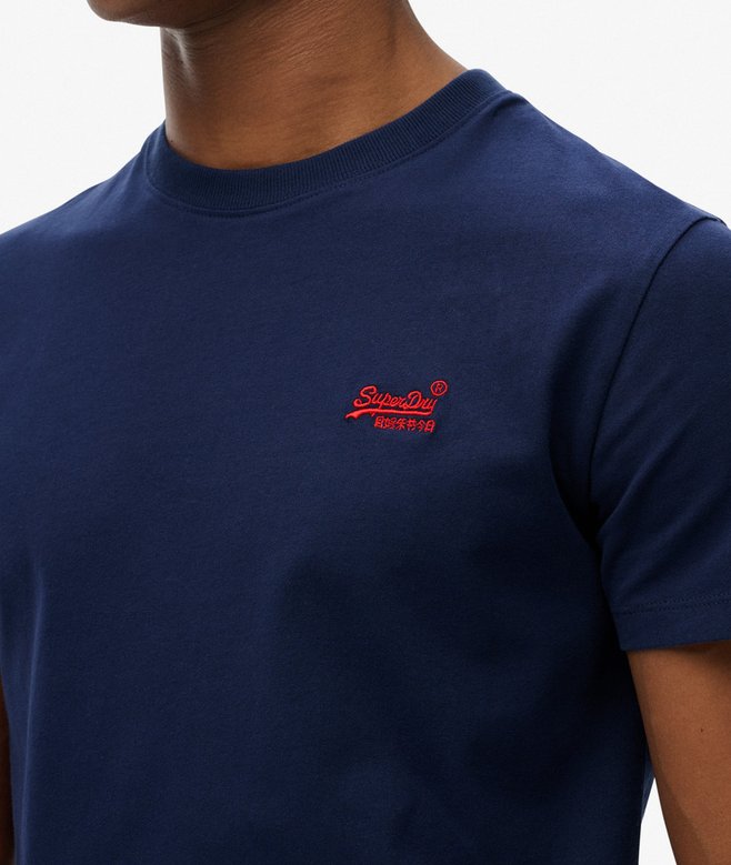 Navy blue t-shirt with a red logo on a neutral background