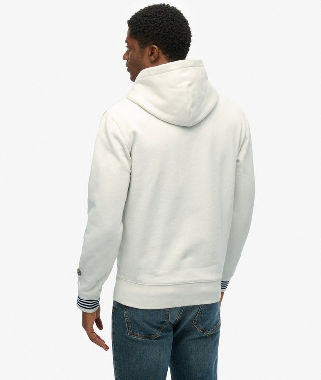 Person wearing a white hoodie and blue jeans on a white background-Back view