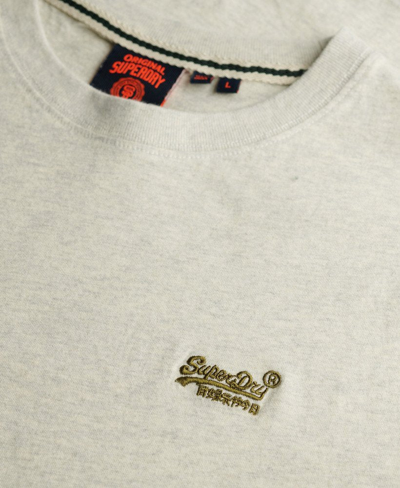 Close-up of a Superdry logo on a light gray t-shirt.