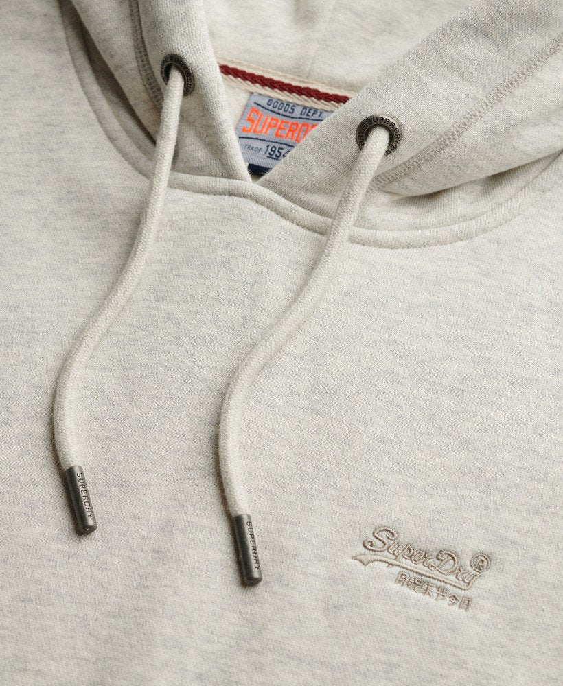Close-up of a gray hoodie with Superdry logo on the chest and label.