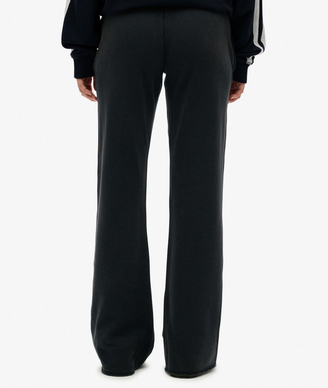 Navy wide-leg pants worn by a person on a white background