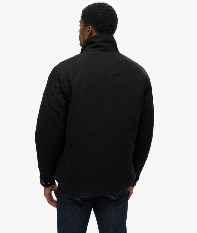 Person wearing a black jacket on a white background