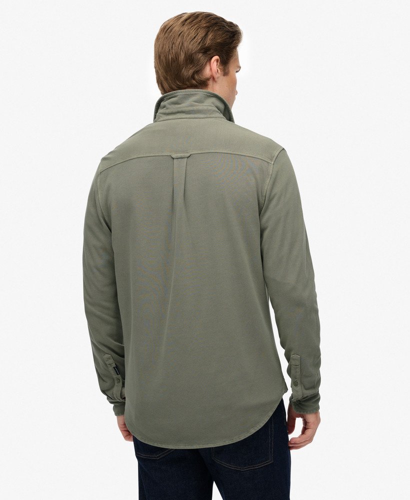 Man wearing a green shirt on a white background