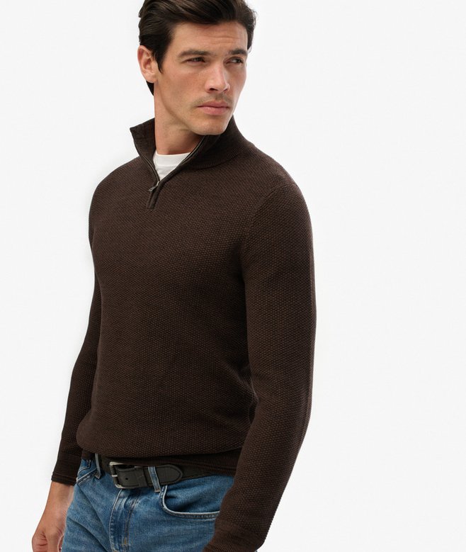 Man wearing a brown sweater with a white background