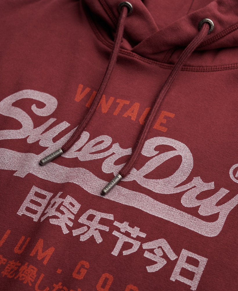 Maroon hoodie with white text and branding