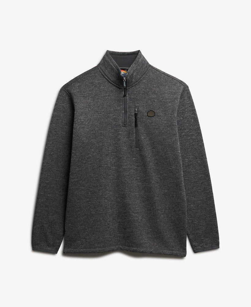 Gray pullover with a quarter zip on a light gray background