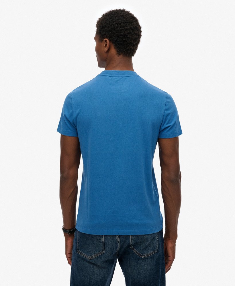 Person wearing a blue t-shirt on a white background