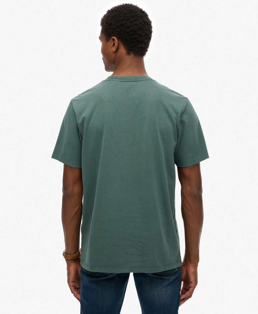 Person wearing a green t-shirt on a white background