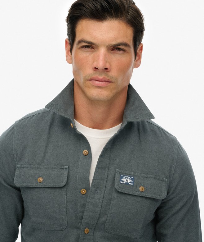Man wearing a green shirt with a collar on a white background