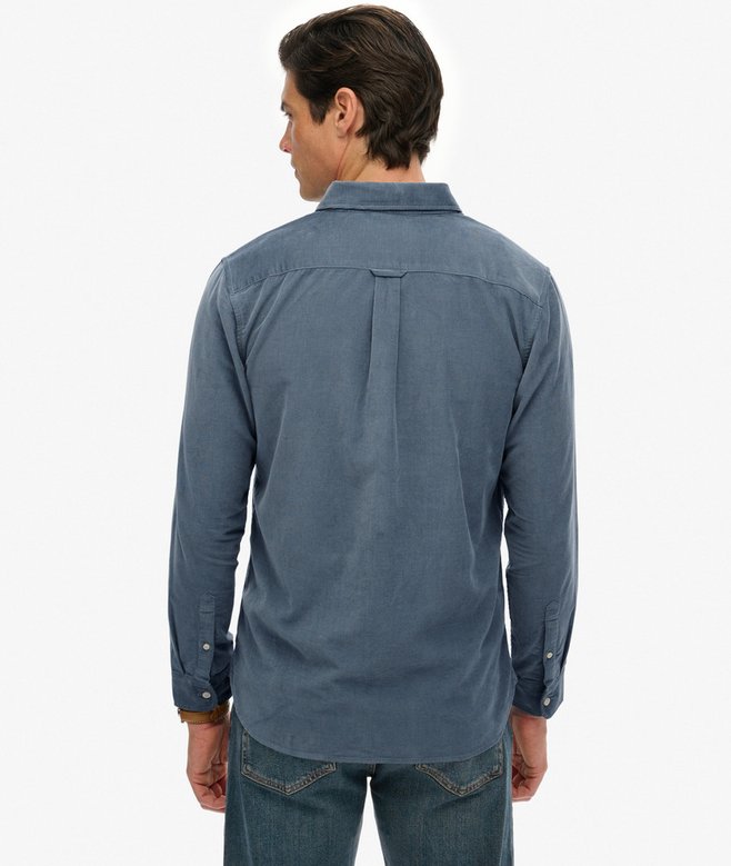 Man wearing a blue shirt on a white background