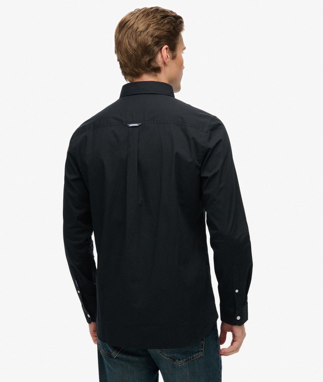 Man wearing a black shirt on a white background