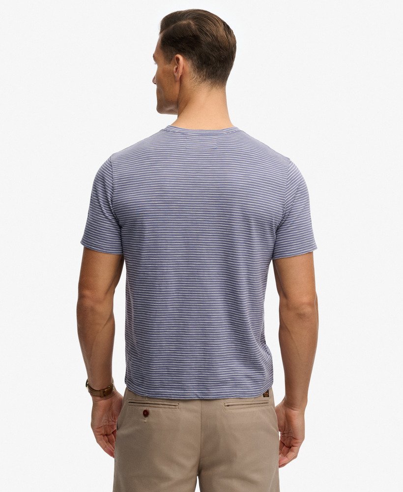 Man wearing a blue striped t-shirt on a white background