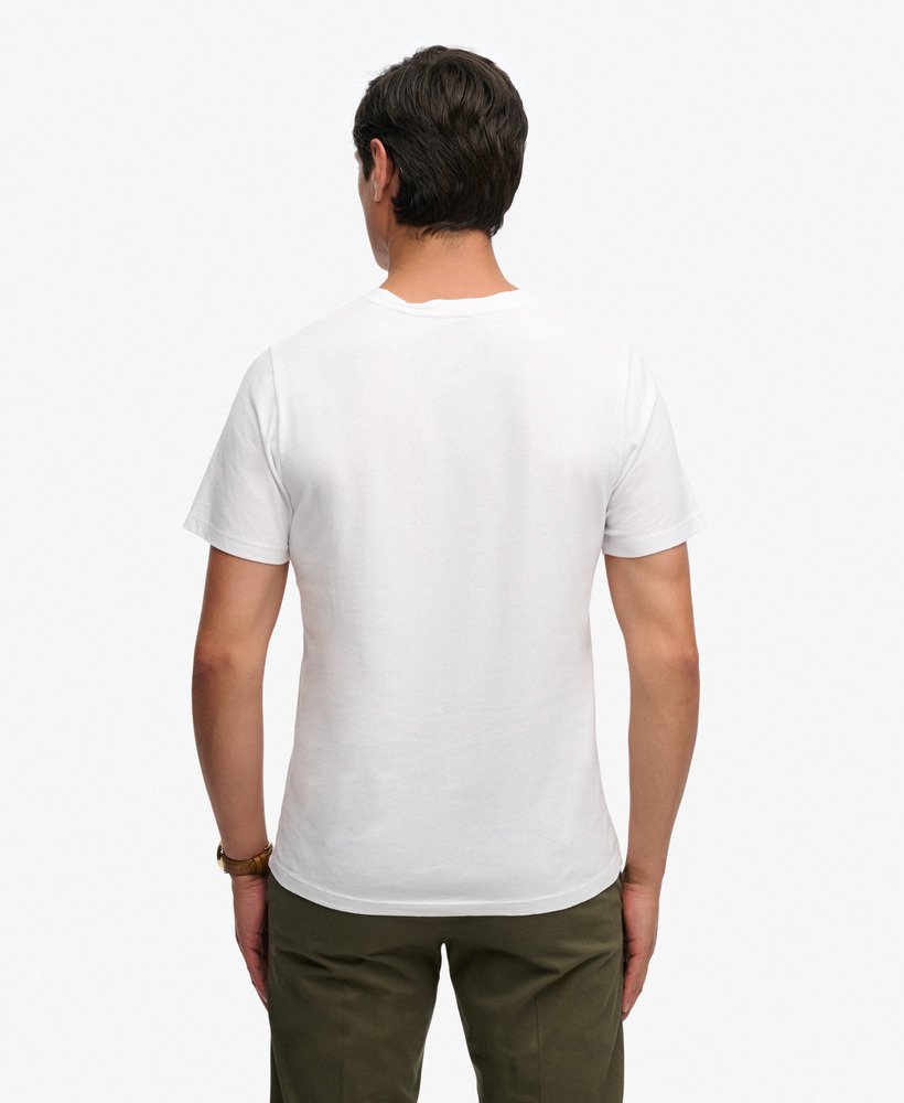 Man wearing a white t-shirt on a white background from behind