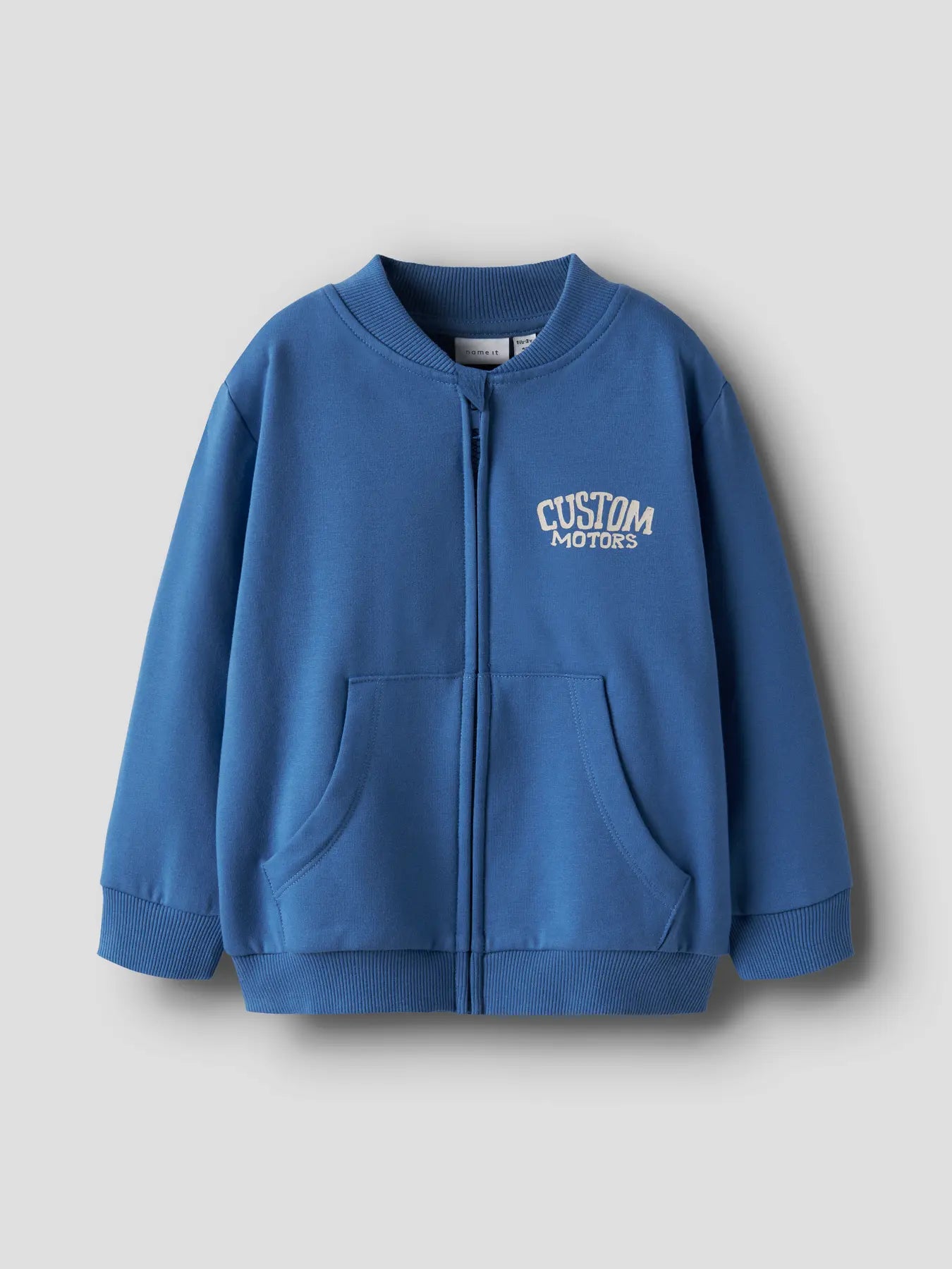 Blue zip-up hoodie with 'Custom Motors' text on a light gray background