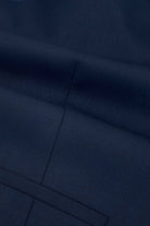 Close-up detail of men's navy tapered trousers