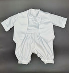 Front view of the boys white christening suit