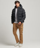 SUPERDRY Black XP-D Sports Puffer Jacket Black model front view