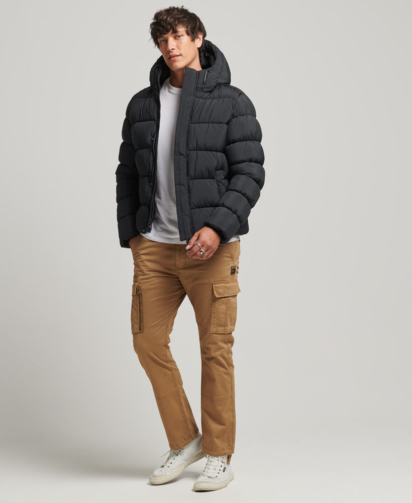 SUPERDRY Black XP-D Sports Puffer Jacket Black model front view